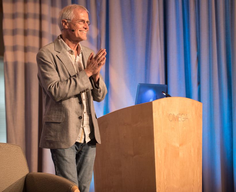 Paul Hawken - tall man with white hair speaking at a podium